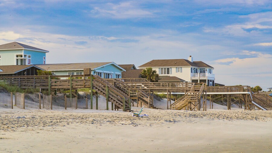 Litchfield Beach which includes a sandy beach and a coastal town