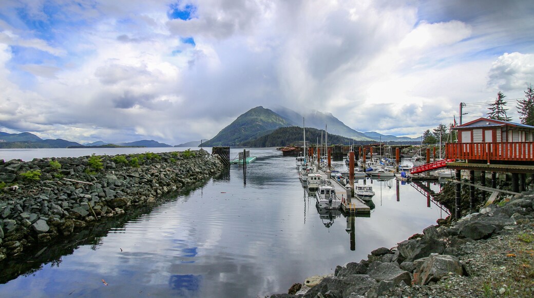 Kelsey Bay - north shore of Vancouver Island, BC. The view on the harbour, boats, rocks, pier and mountains in the background.