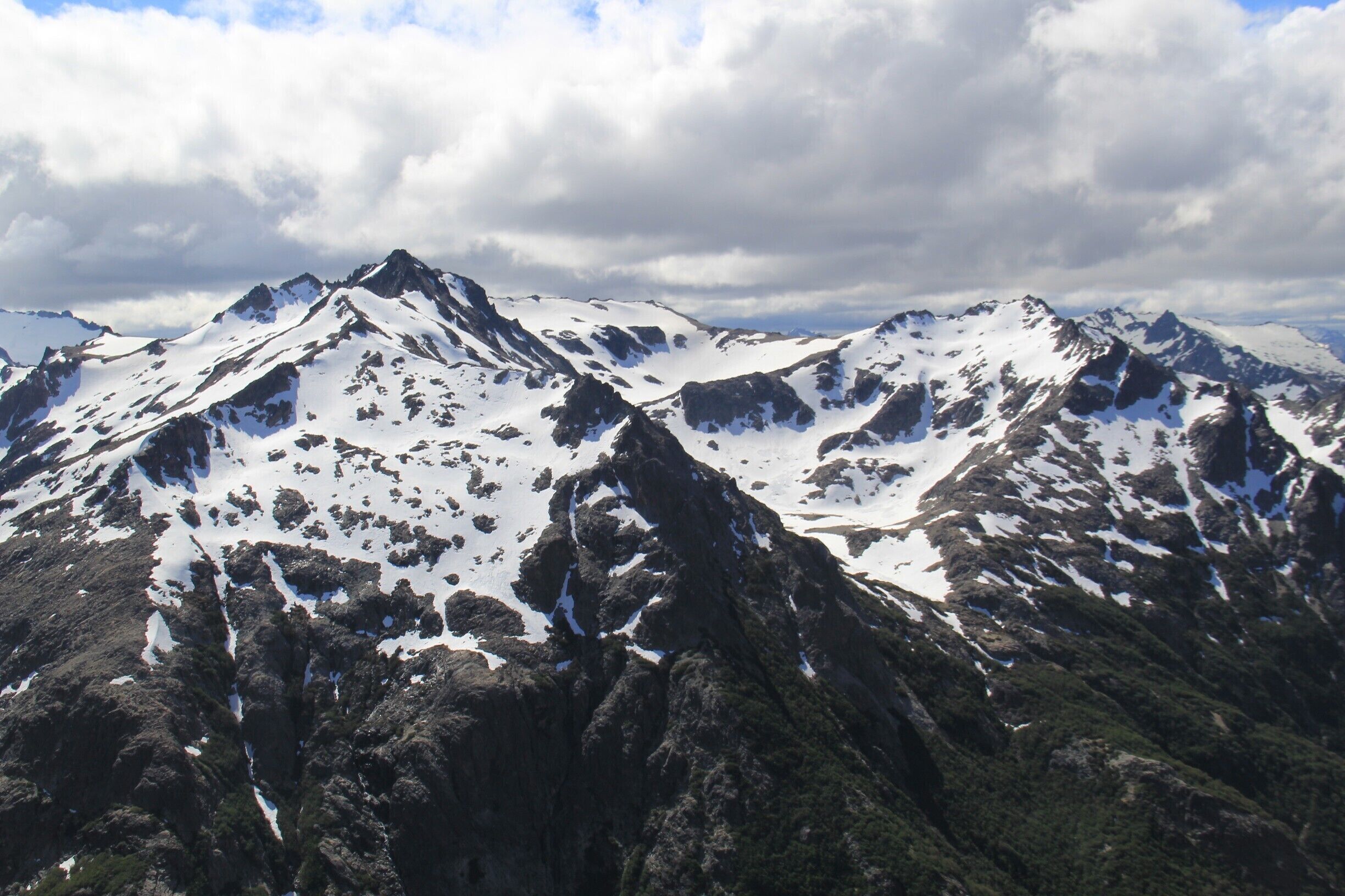 Beautiful snow packed mountains of Patagonia. Patagonia, the rugged ice fields of Argentina offer some of the best hikes I have ever been on in my entire life. Some are a bit challenging, like this one in Bariloche. This hike began by a pristine lake, Gutierrez, then up to Cerro Frey. From Cerro Frey we had to cross a steep snowy pass and it is definitely harder than it looks. Hard, but rewarding. 

#ARGENTINA #HIKING #OUTDOORS #PATAGONIA 
