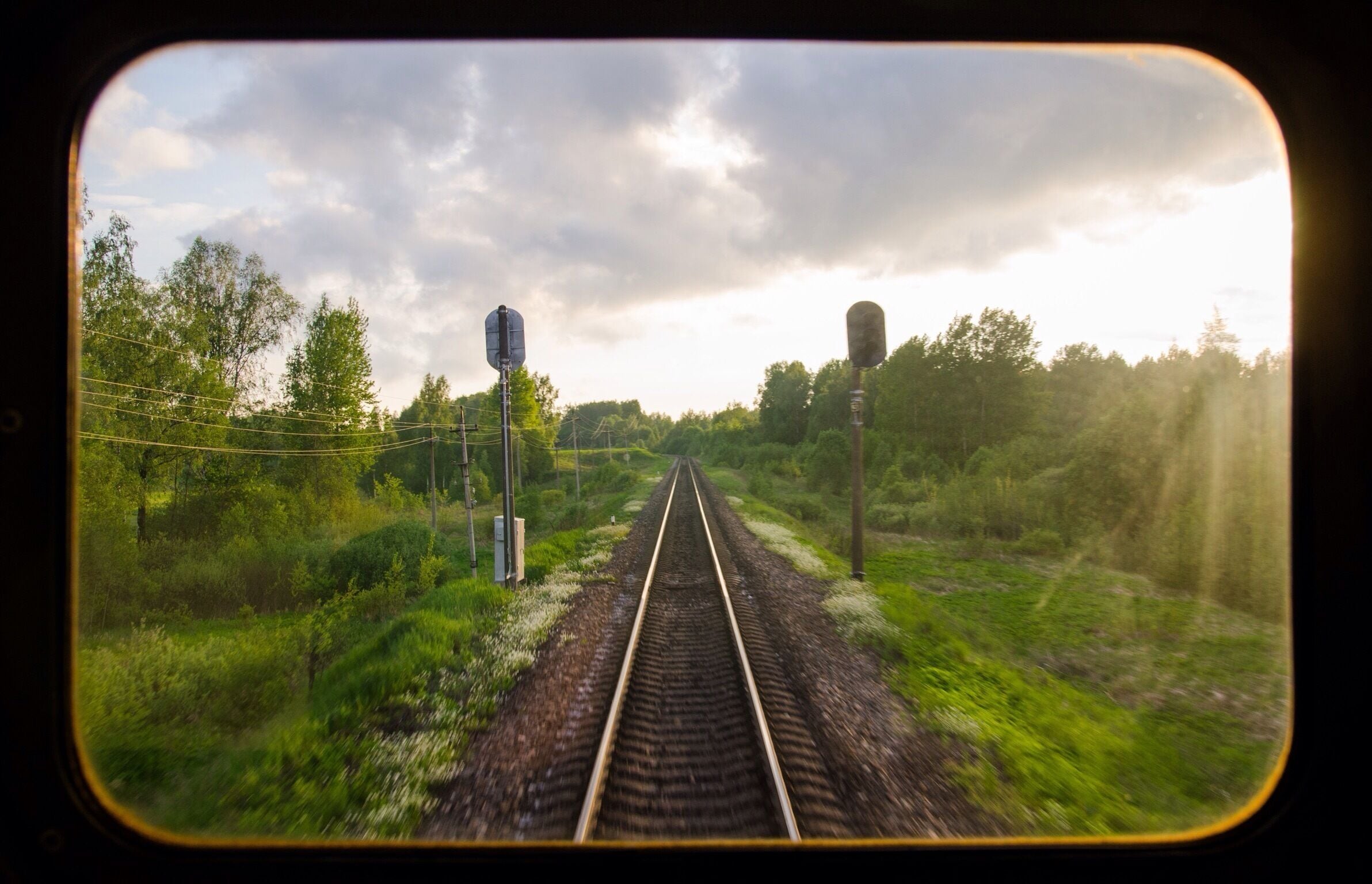 Last summer we spent a month travelling overland by train from London to Beijing. The Trans-Siberian railway was a real 'bucket-list' trip for us and we loved the time spent on the trains. 

In Russia especially, where the trains moved slowly across the never-changing countryside for hours and hours and HOURS on end we got into a a new rhythm of travel. It wasn't about where we were headed but enjoying the journey - reading, eating, chatting, napping, playing cards and most of all watching the world go by outside our window.