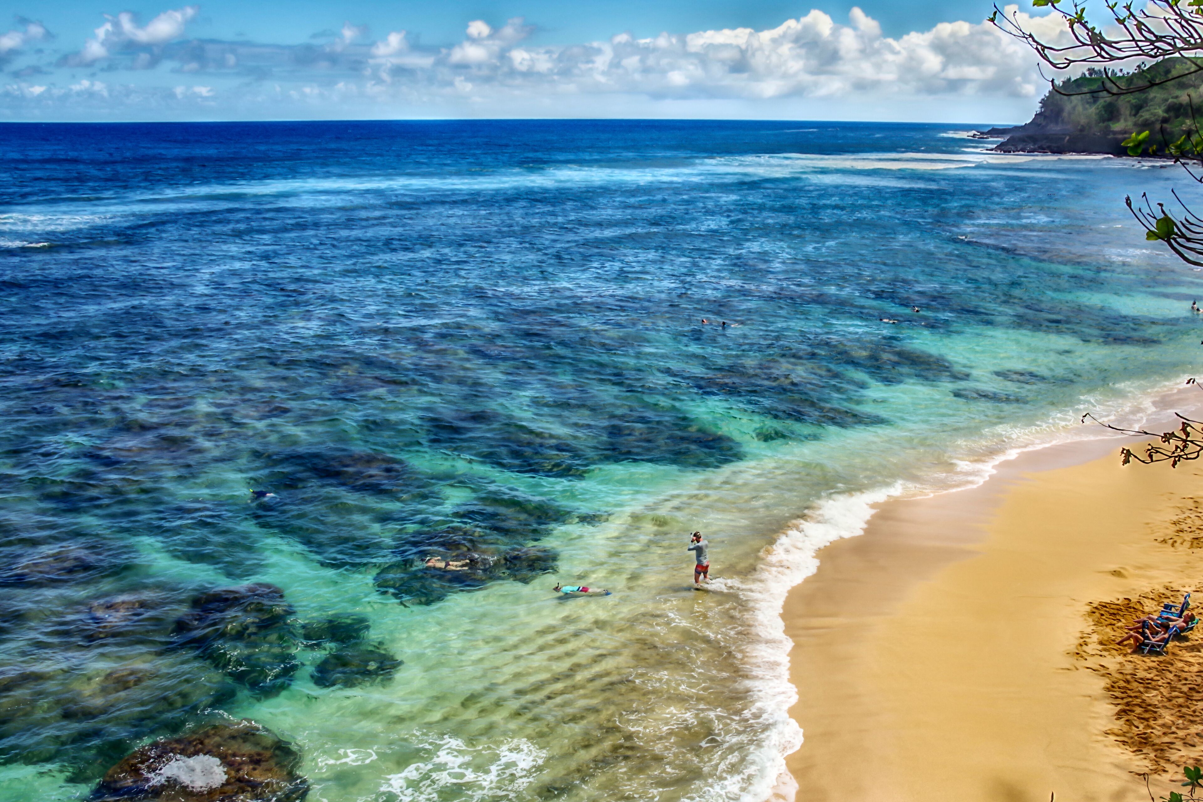 Princeville, Kauai, HI USA 04/16/19: Beautiful aqua blue water and reef at Hideaway Beach on Kauai's north shore.