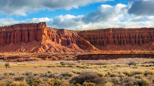 American Southwest Desert Landscape. Classic eroded Navaho sandstone bluffs and blue skies bring up an image of the old west. This is especially true here in Torrey, Utah, near Capitol Reef Park.