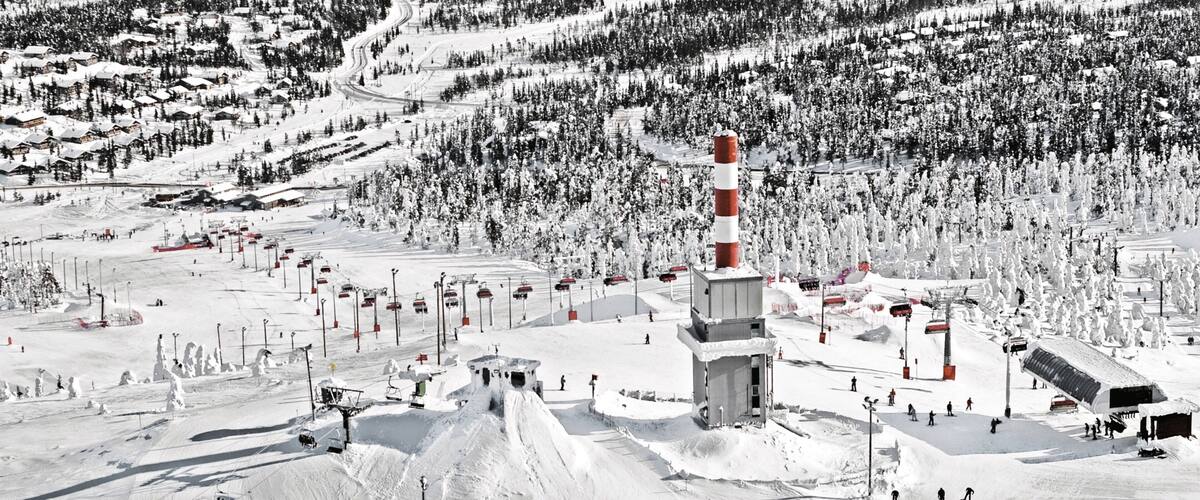 Ruka Ski Area showing snow and forests