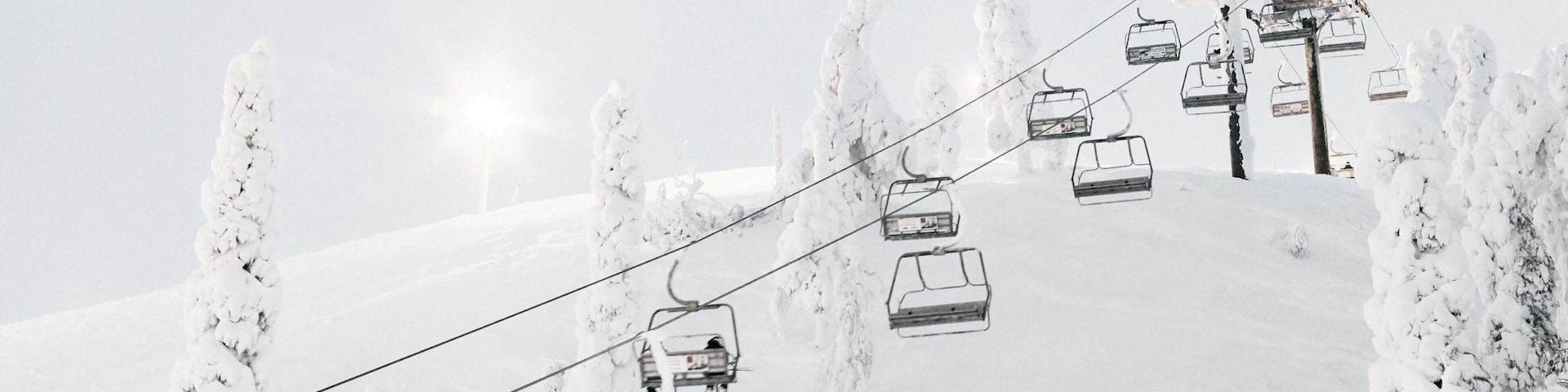 Ruka Ski Area showing mountains, a gondola and snow