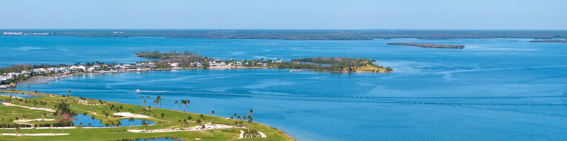 Large golf course and sports grounds with green grass in Boca Grande, small town on Gasparilla Island in southwest Florida