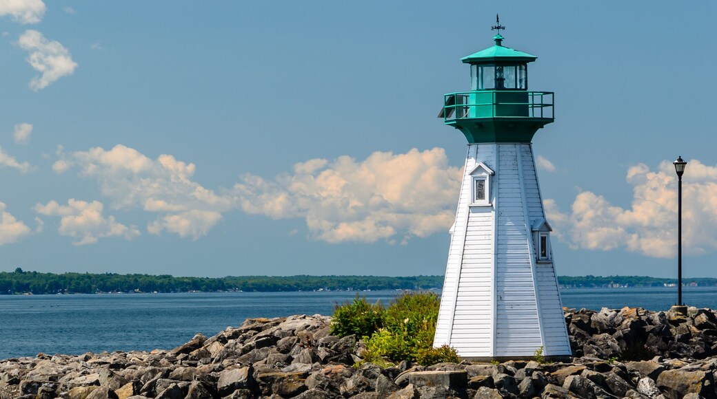 White and green Harbour lighthouse on the breakwater overloking the St. Lawrence River