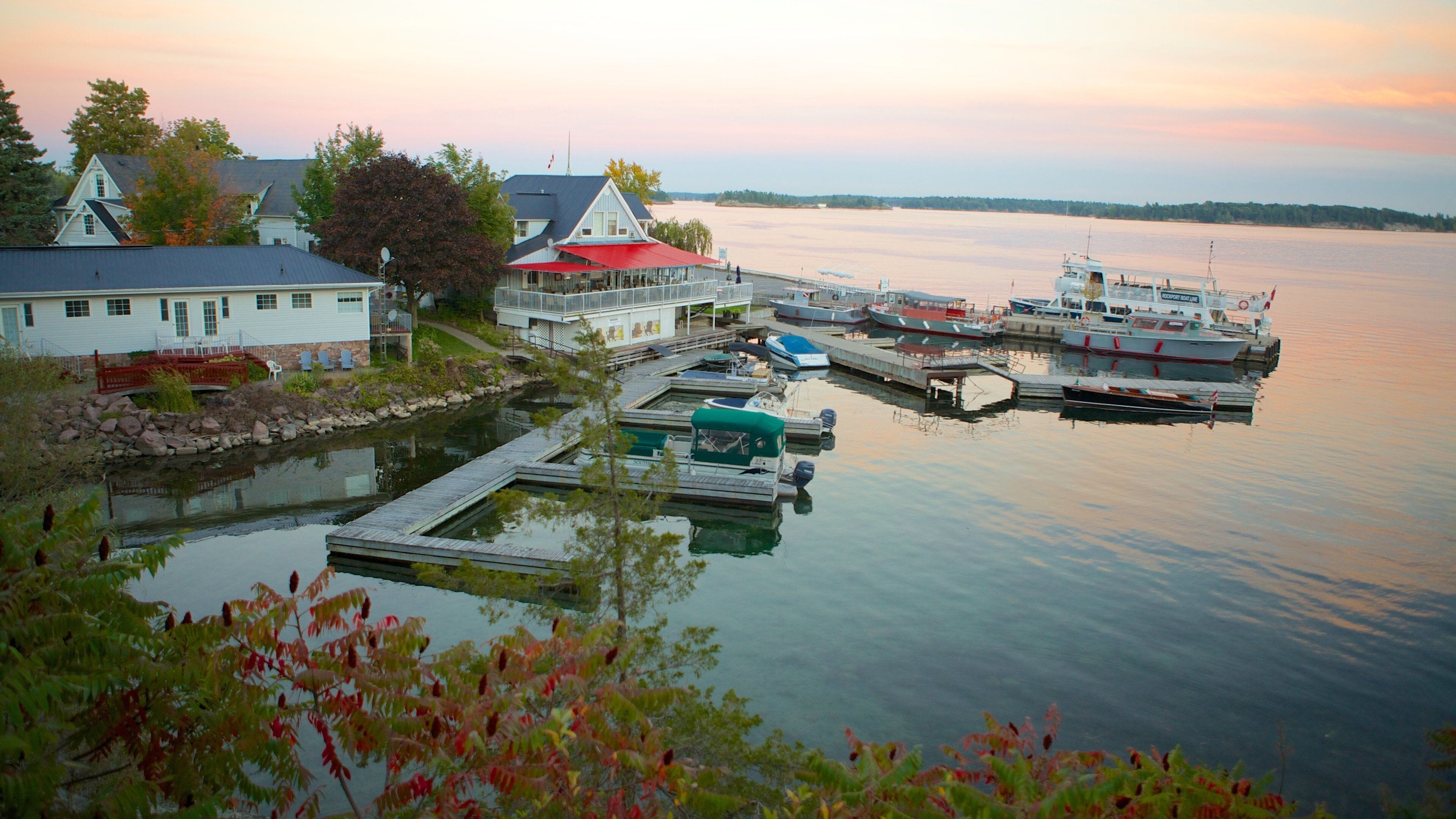 Rockport featuring a sunset and a lake or waterhole