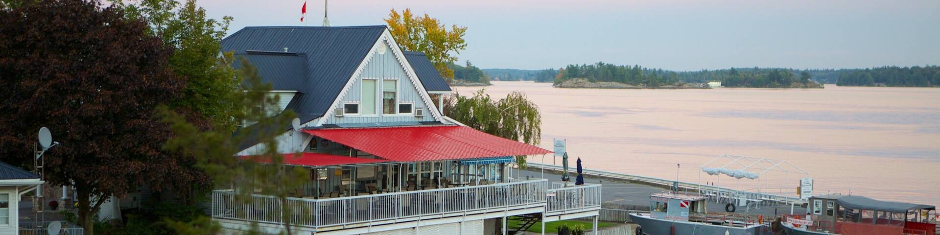 Rockport which includes a lake or waterhole and a sunset