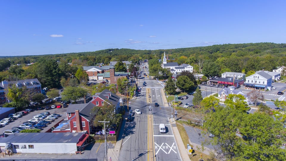 A town with a main street, buildings, and a church.