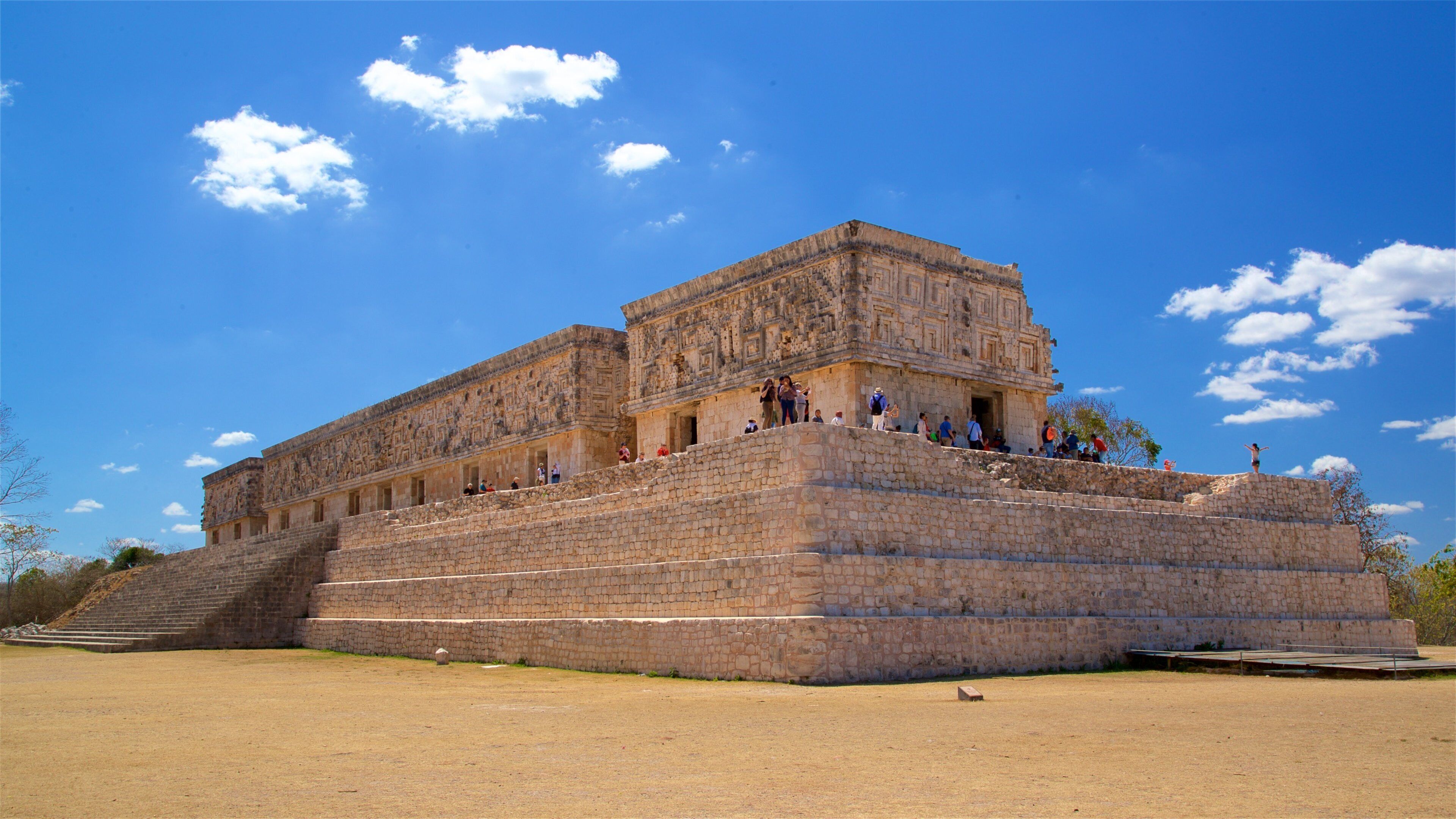 Governors Palace featuring heritage architecture as well as a small group of people