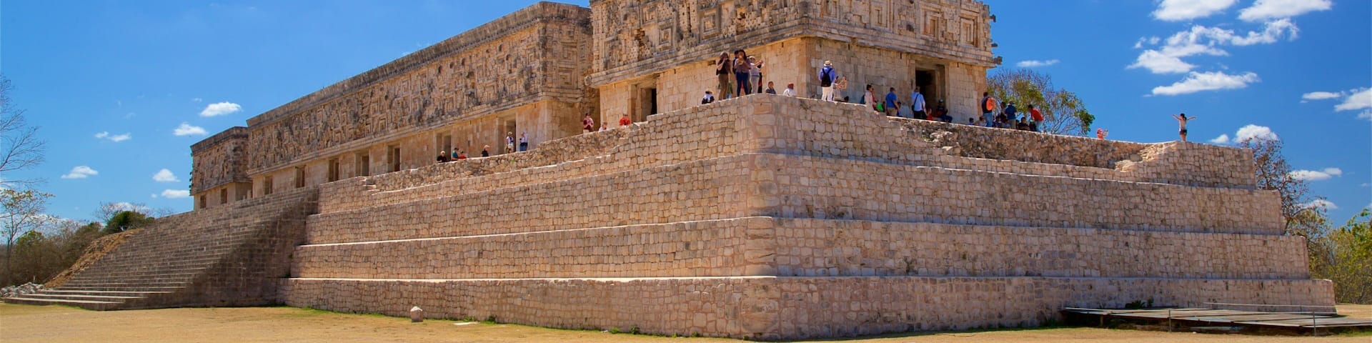 Governors Palace featuring heritage architecture as well as a small group of people