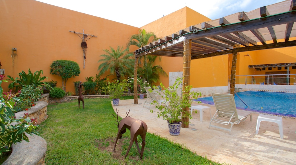 Casa de los Venados showing a pool and outdoor art