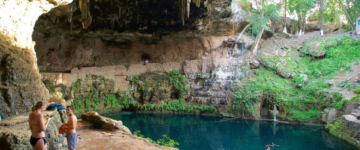 Cenote Zaci featuring a lake or waterhole as well as a couple
