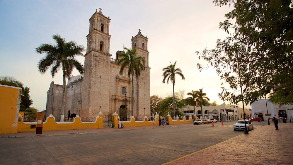 Cathedral of San Gervasio which includes heritage architecture and a sunset