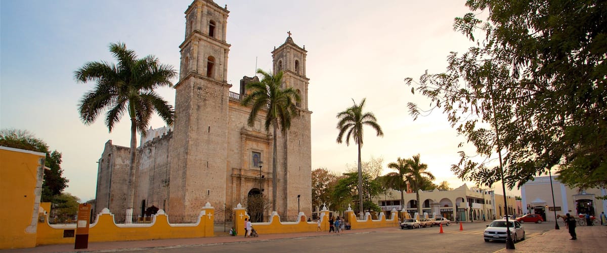 Cathedral of San Gervasio which includes heritage architecture and a sunset
