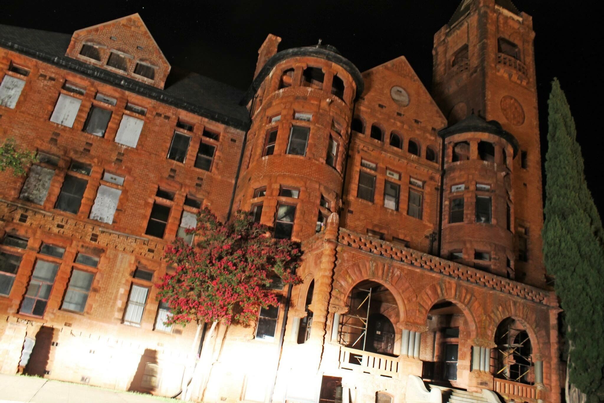 Spent a night locked in this abandoned and haunted reformatory with my family and some ghost hunters. We held a seance, took EVPs, and stumbled around in the dark. There were bats and owls flying up and down the pitch black halls. We heard voices coming and had flashlights and other electronic equipment go haywire. Their ghost tours are on hold while repairs are made to the building last time I checked. 