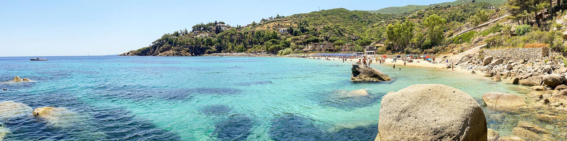 View to Cannelle beach, Spiaggia delle Cannelle, near Giglio Porto with view to mediterranean sea and beautiful blue bay at Isola del Giglio, island of the tuscan archipelago, Grosseto Tuscany Italy