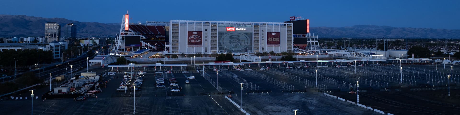 Santa Clara, United States - 02 September 2025: Aerial view of Levi's Stadium under the fading blue of twilight, a modern coliseum amidst orderly parking lots.