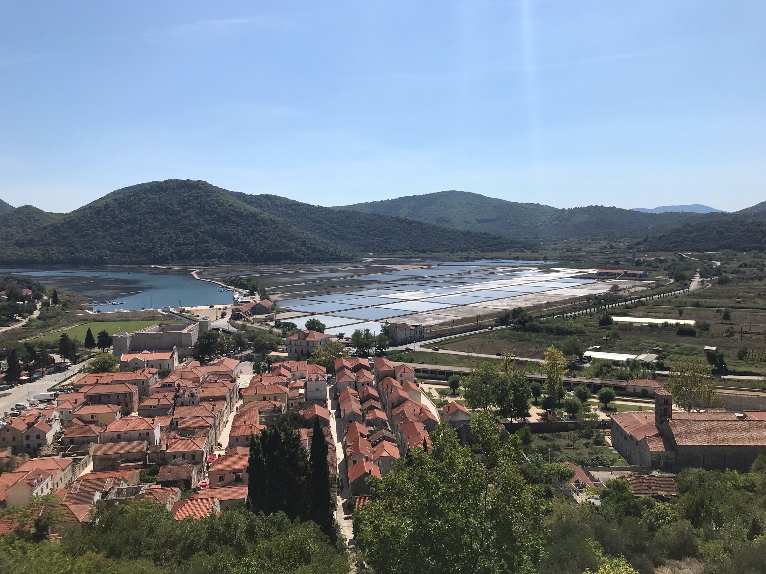 Hiked up the stone wall, stopping to take a picture of the city and the Sea Salt mines