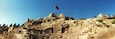 Panoramic view of Byzantine castle of Kalekoy with a Turkish national flag, Antalya Province, Turkey.