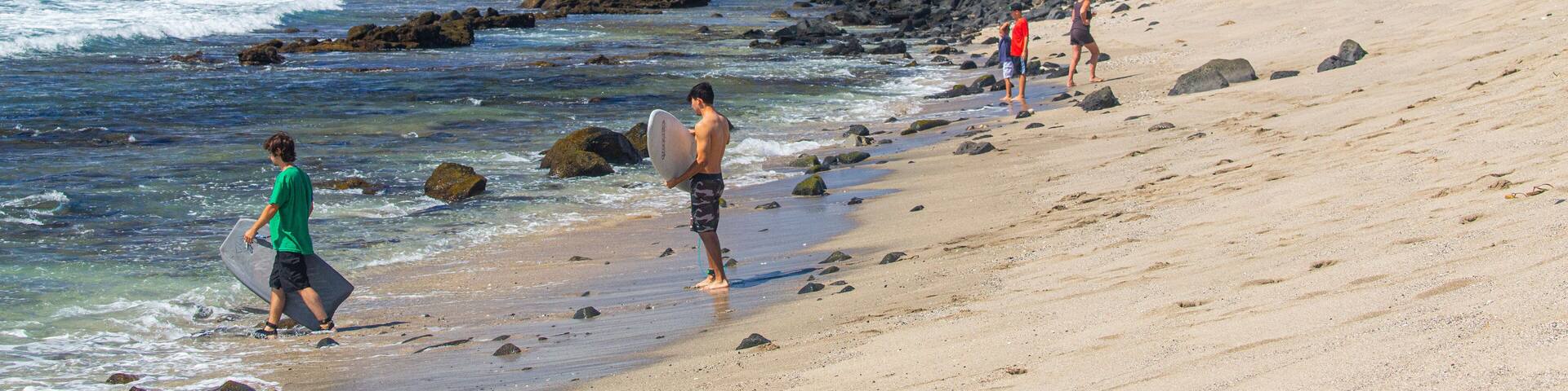 Old Kona Airport State Recreation Area which includes a sandy beach and general coastal views