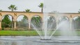 Venetian Bay Golf Club showing a fountain, a park and signage