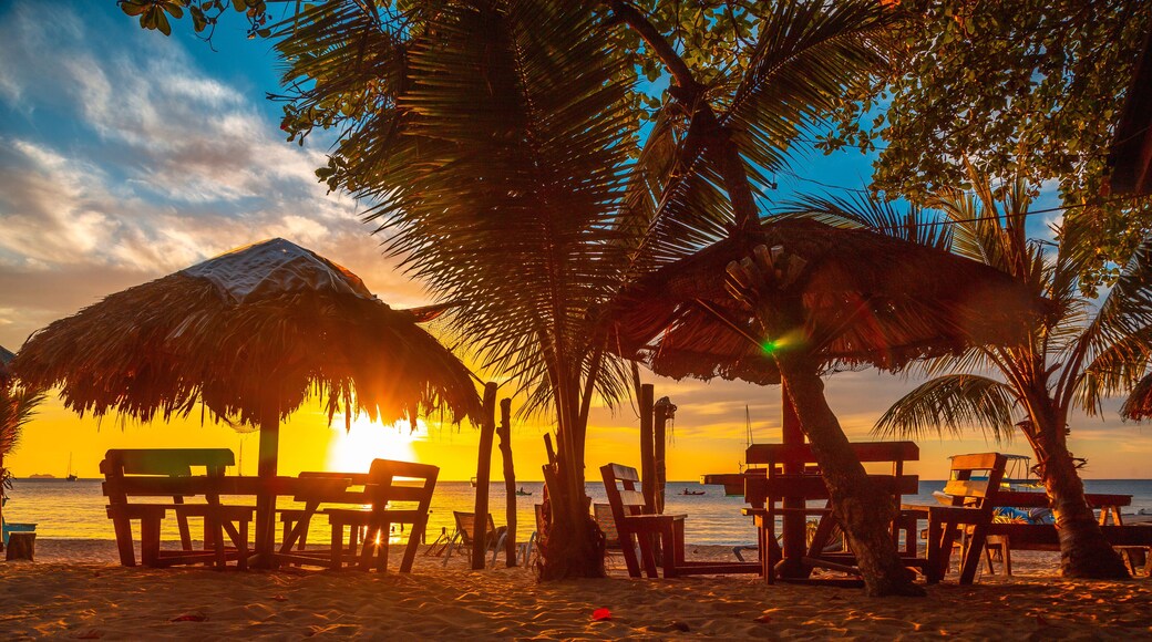 A terrace on the beach at Sunset from West End Beach, Roatan Island. Honduras