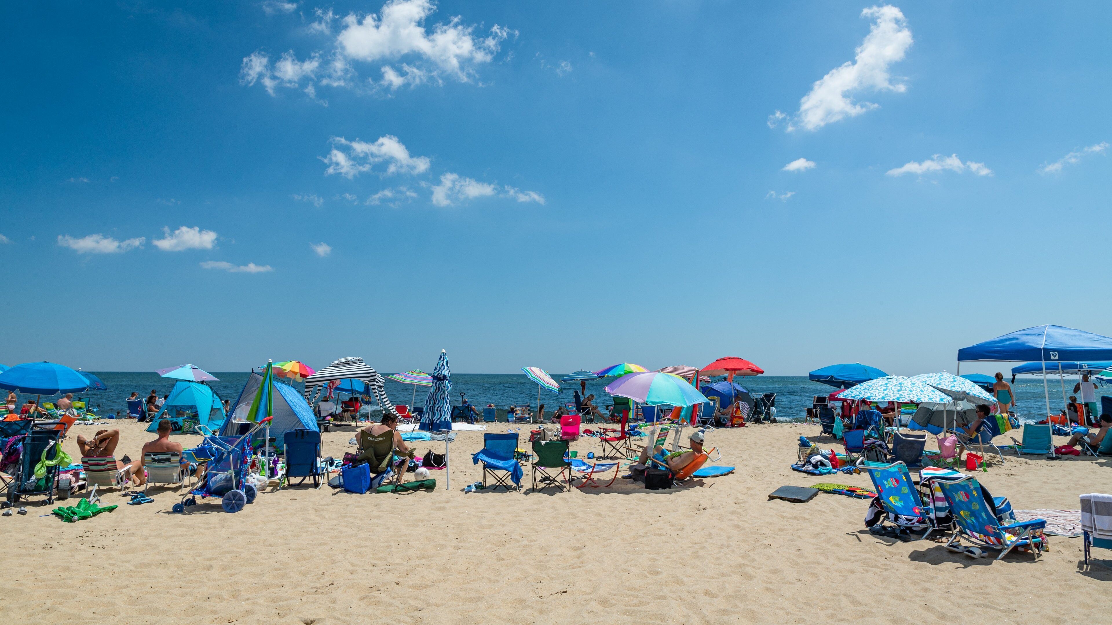 North Ocean City which includes a sandy beach and general coastal views as well as a large group of people