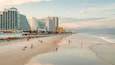 Beach at Daytona Beach which includes a sunset, a beach and general coastal views