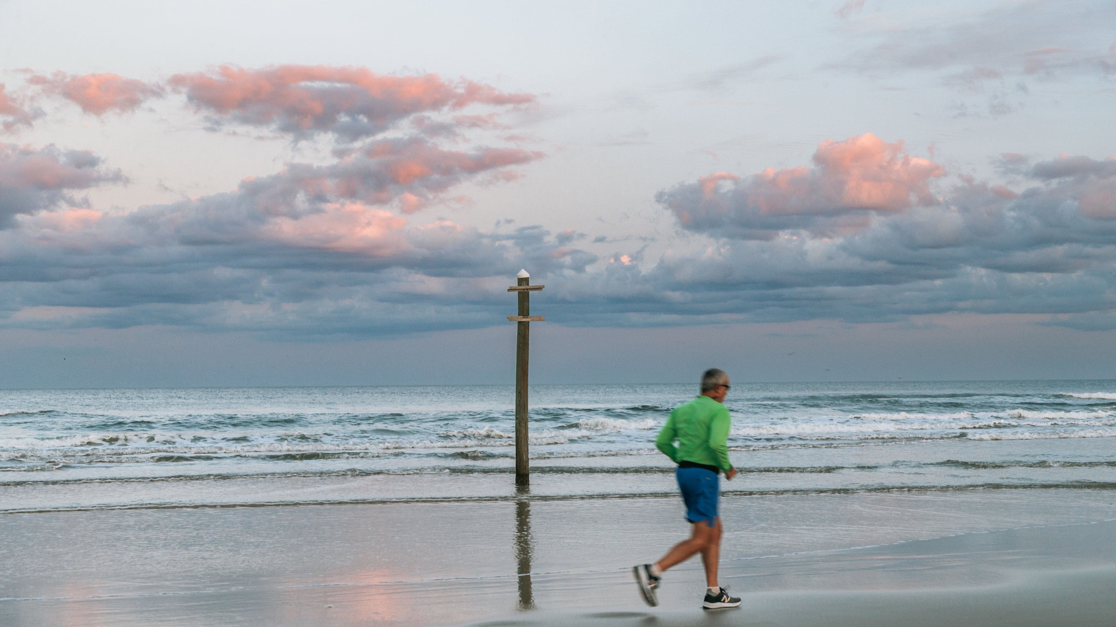 Beach at Daytona Beach showing a sunset, a sandy beach and general coastal views