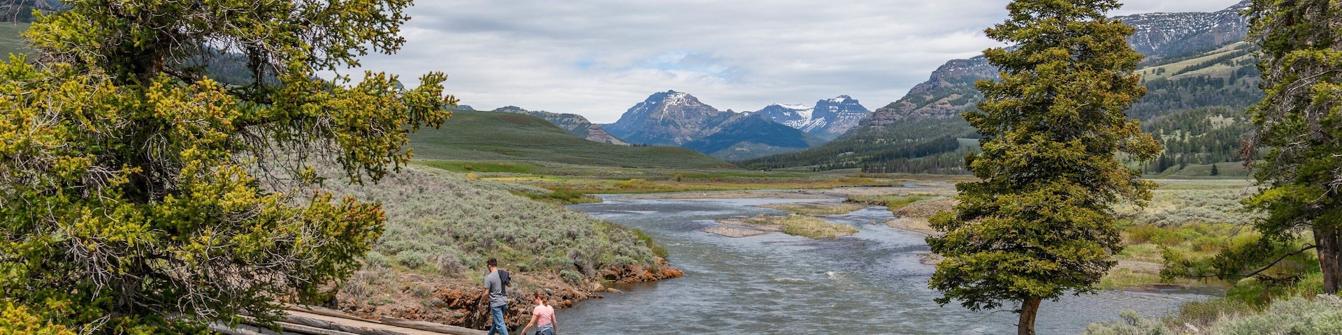 Lamar Valley featuring a river or creek and hiking or walking as well as a couple