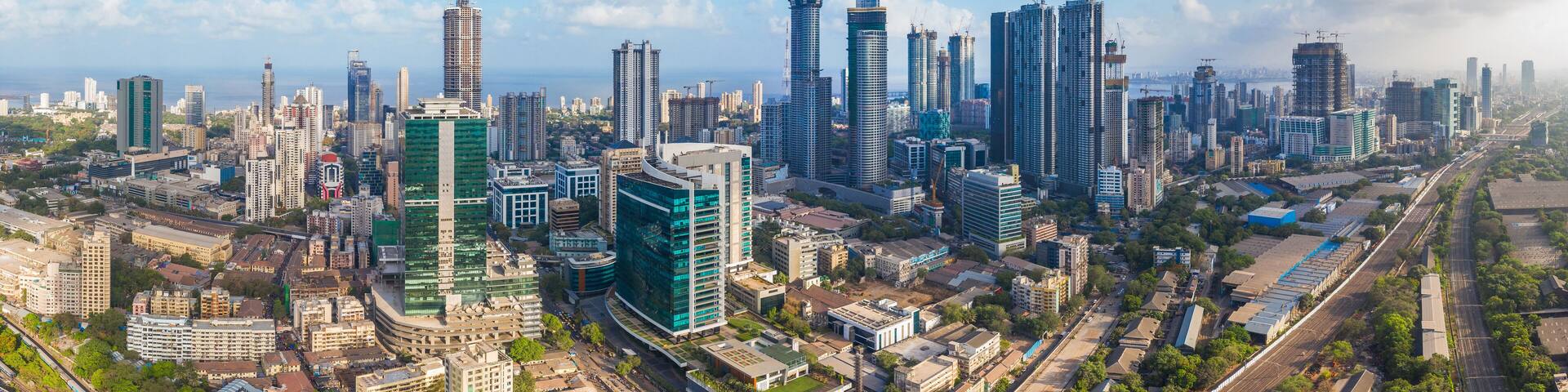 Aerial panoramic view Mumbai's Lower Parel skyline, with Worli, Prabhadevi, Elphinstone, Dadar and Bandra also visible.