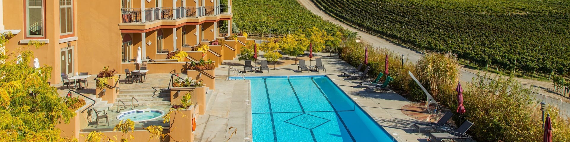 Burrowing Owl Estate Winery showing a pool, a hotel and farmland