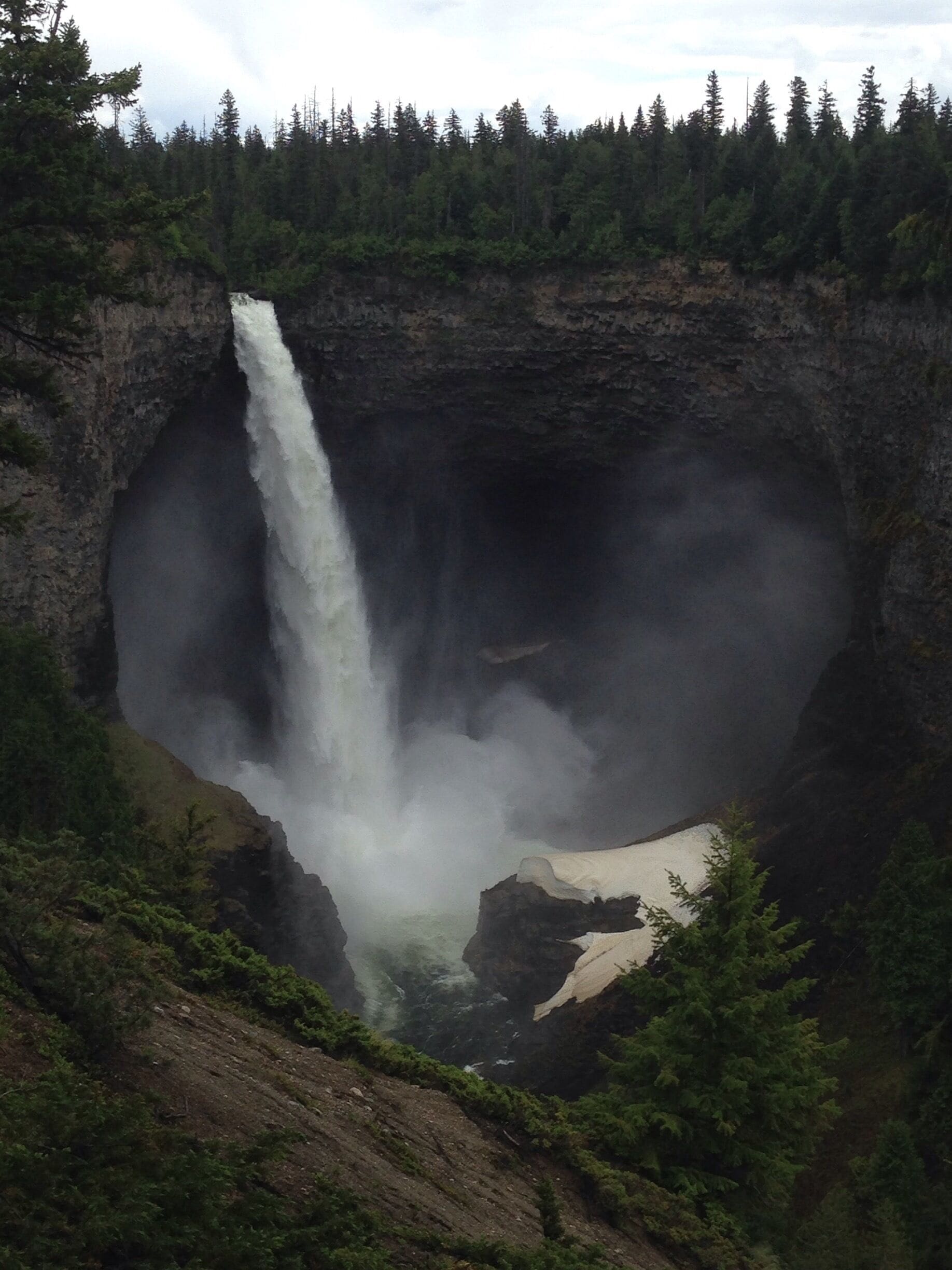 My attempt at trying to zoom into the cave below. The water is so cold that there still sits snow next to it. In the winter I heard that these falls will actually freeze into a solid mass as if it's frozen in time. 