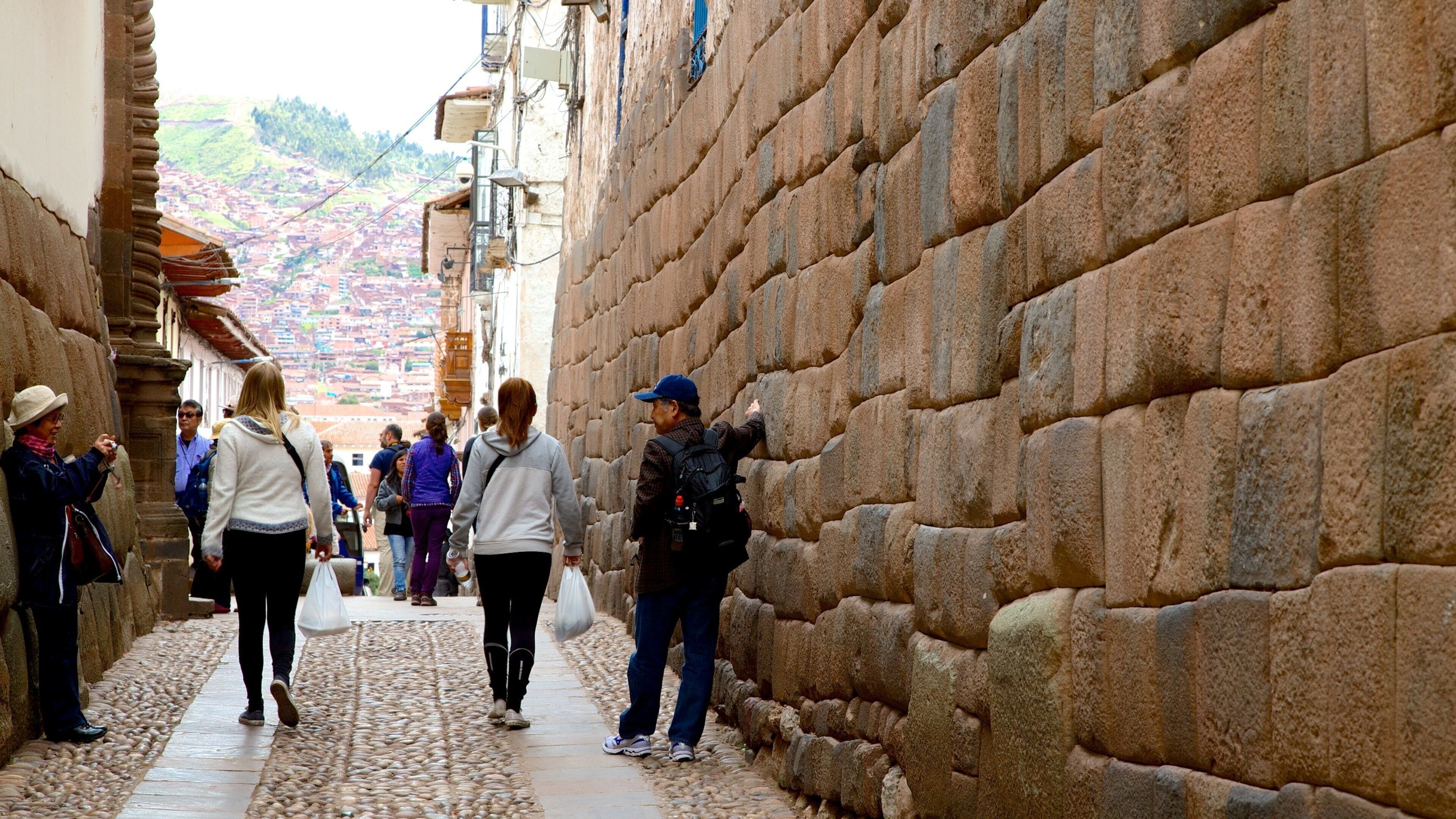 Hatunrumiyoc which includes street scenes as well as a large group of people
