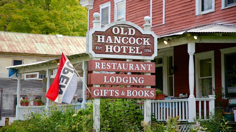 A sign for the Old Hancock Hotel, indicating it offers a restaurant, lodging, and gifts & books.