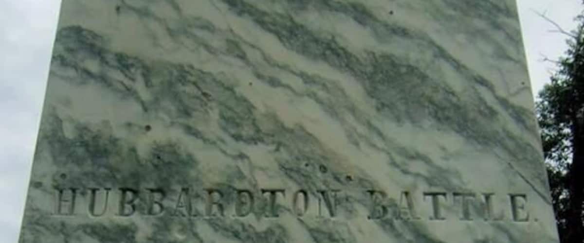 A marble monument with the inscription "HUBBARDTON BATTLE. Fought on this Ground July 1777."