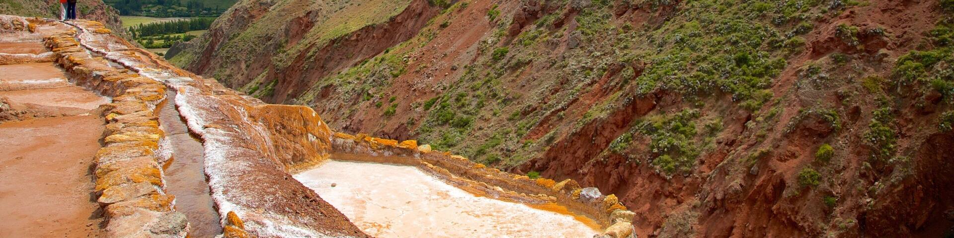 Salt Mines Of Maras showing mountains and landscape views