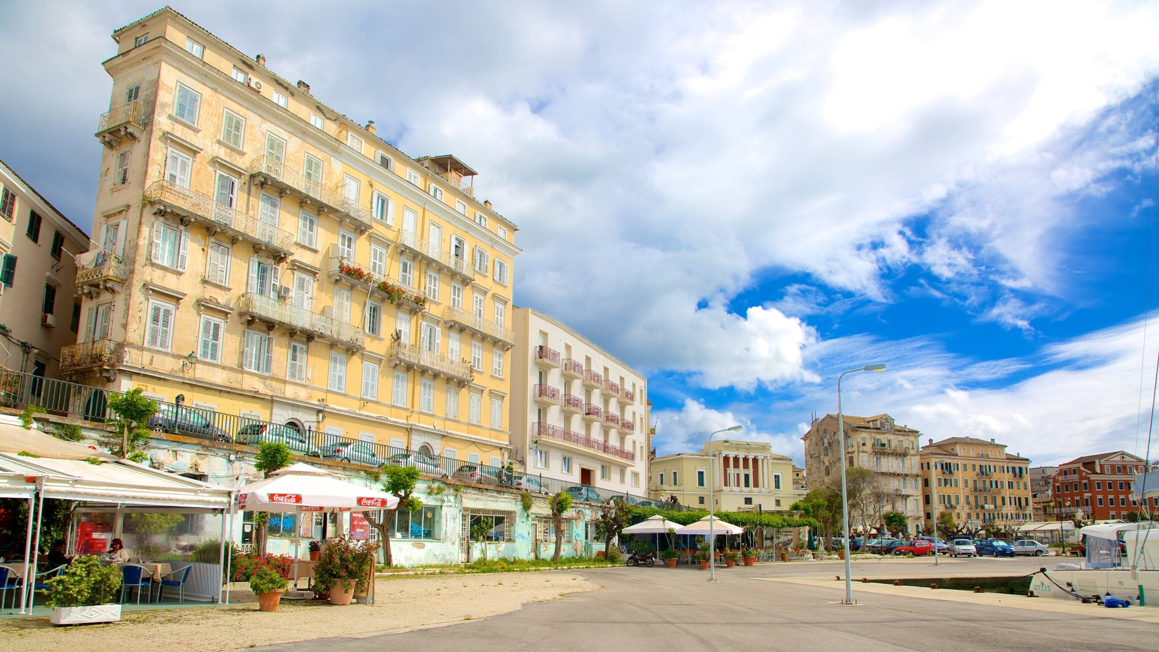 Port of Corfu featuring heritage architecture and street scenes
