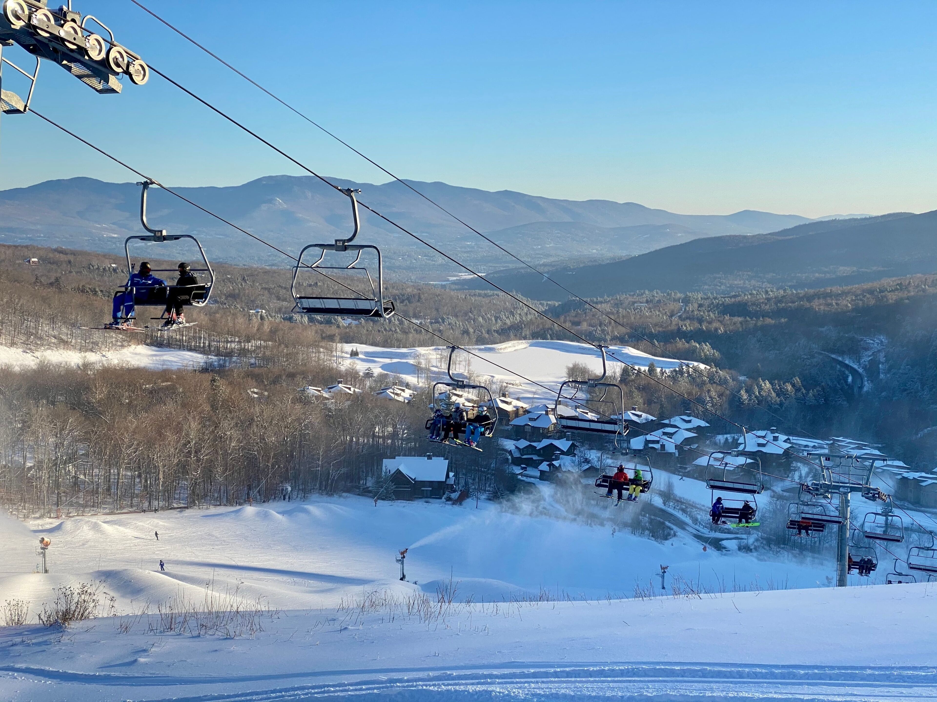 Skiers getting up at the chair lift at vermont ski resort