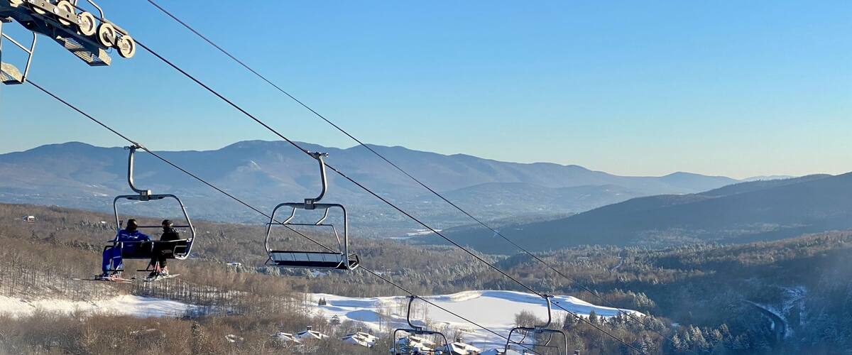 Skiers getting up at the chair lift at vermont ski resort
