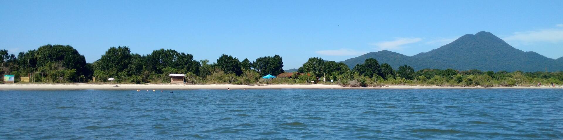 Blue sea with the Long Island (Ilha Comprida) in the background, in Cananeia, South Coast of Sao Paulo, Brazil, April 2016.; Shutterstock ID 1031993806; Purchase Order: -