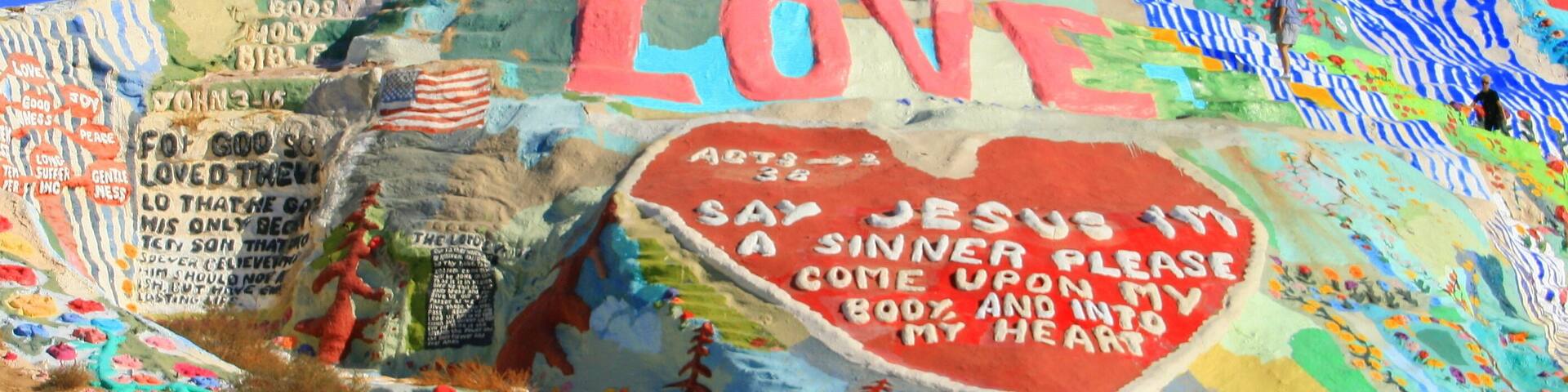 Salvation Mountain is a colorful artificial mountain north of Calipatria, California, near Slab City. It is made from adobe, straw, and thousands of gallons of paint.; Shutterstock ID 82139752