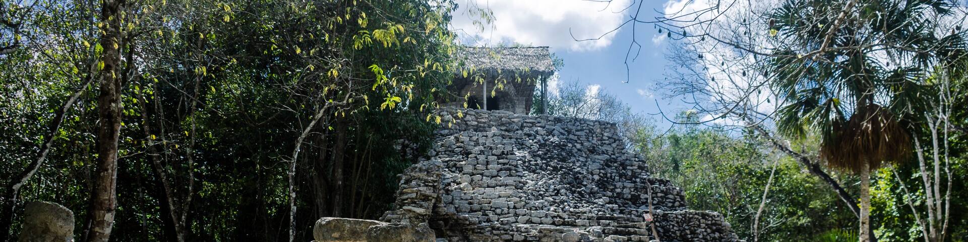 Painting group at archaeological site of Coba, Mexico
