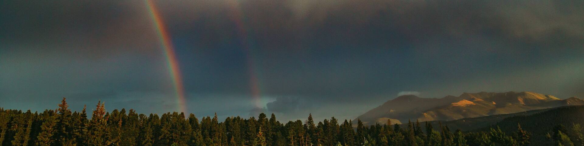 Double rainbow over Colorado Rocky Mountains