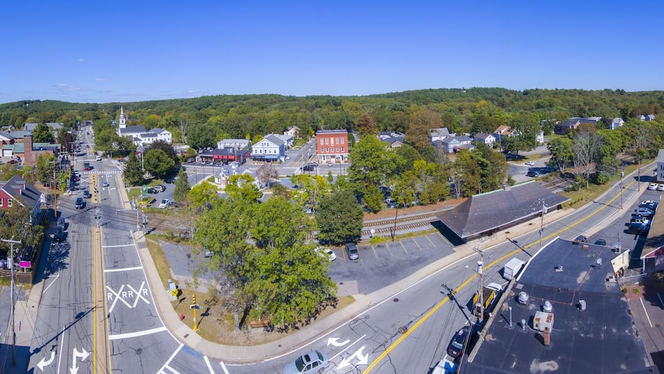 A town with a main street, a church, and residential buildings.