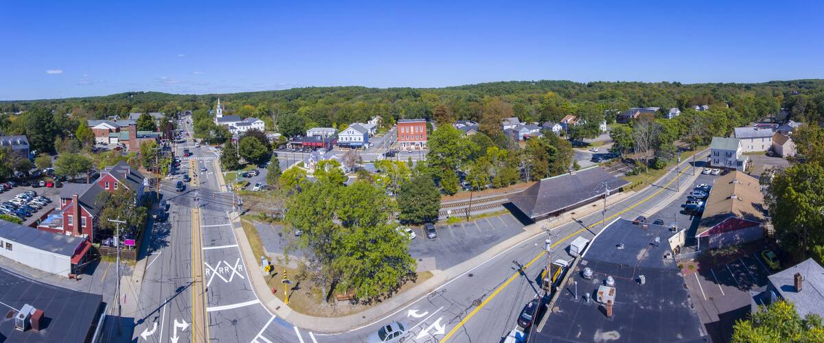 A town with a main street, a church, and residential buildings.