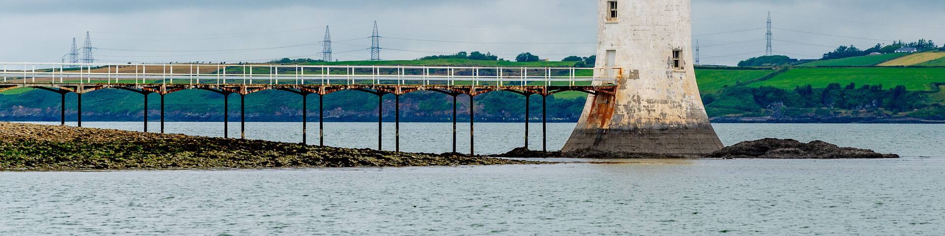 Tarbert Lighthouse on the coast of the sea