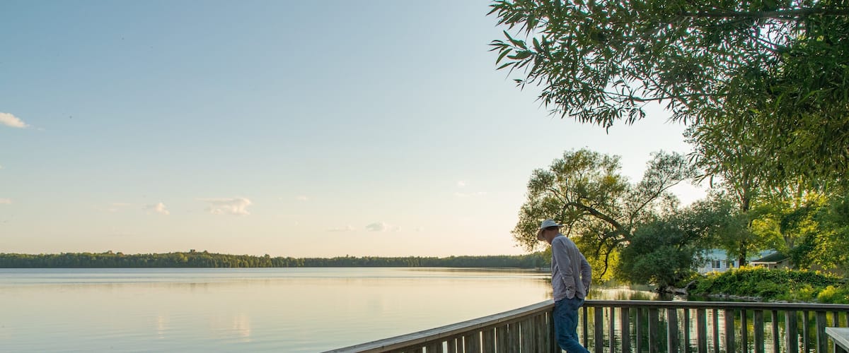 Lake on the Mountain Provincial Park showing a lake or waterhole and a sunset as well as an individual male
