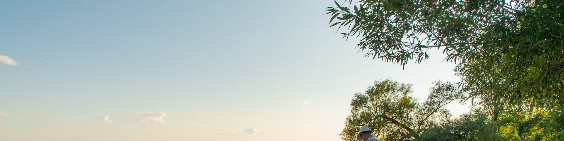Lake on the Mountain Provincial Park showing a lake or waterhole and a sunset as well as an individual male